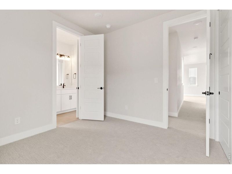 Spacious, unfurnished interior of a new home in RainDance, Windsor (Image 17).