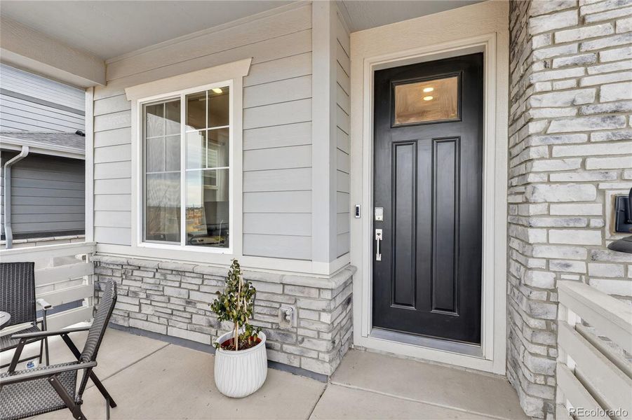 Exterior details and patio area of a home in Prelude at The Aurora Highlands, Aurora (Image 28).