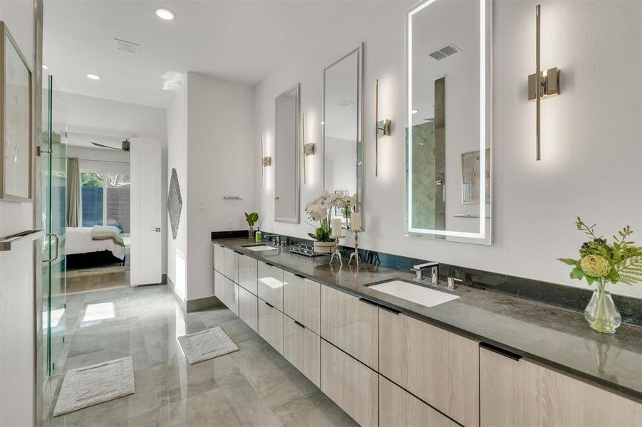 Bathroom featuring ceiling fan and vanity