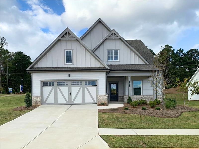 Front exterior of a new home in Twelve Parks 55+, Sharpsburg, GA, highlighting curb appeal (Image 1). Front exterior of a new home in Twelve Parks 55+, Sharpsburg, GA, highlighting curb appeal (Image 1).