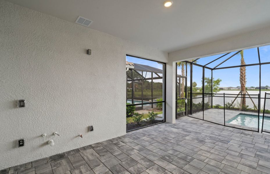 Exterior details and patio area of a home in Del Webb Oak Creek, North Fort Myers (Image 2).