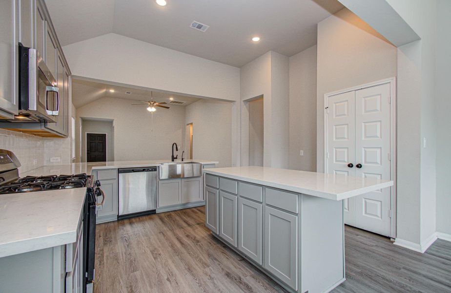 Upgraded stunning quartz island kitchen