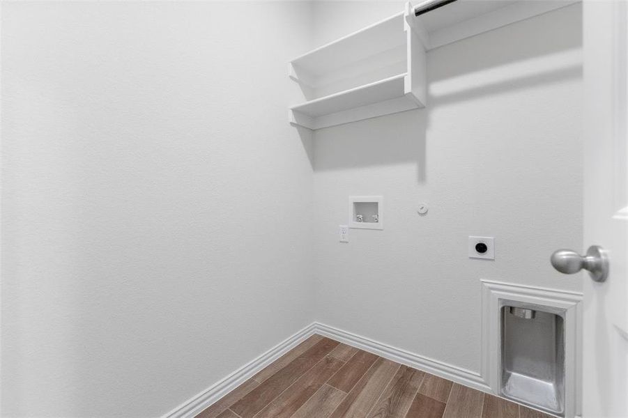 Laundry area featuring gas dryer hookup, wood finished floors, hookup for an electric dryer, and hookup for a washing machine