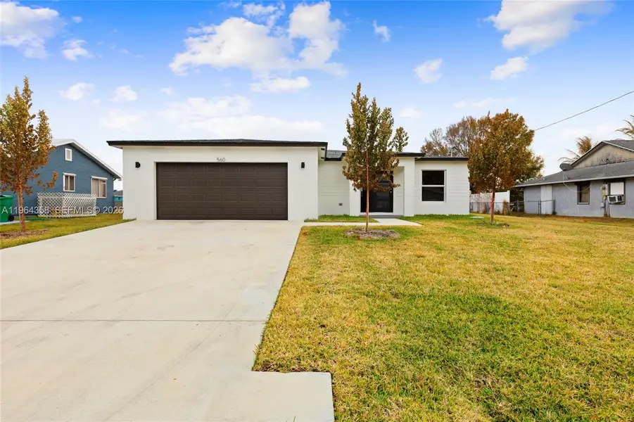 Front exterior of a new home in , Port St. Lucie, FL, highlighting curb appeal (Image 18). Front exterior of a new home in , Port St. Lucie, FL, highlighting curb appeal (Image 18).