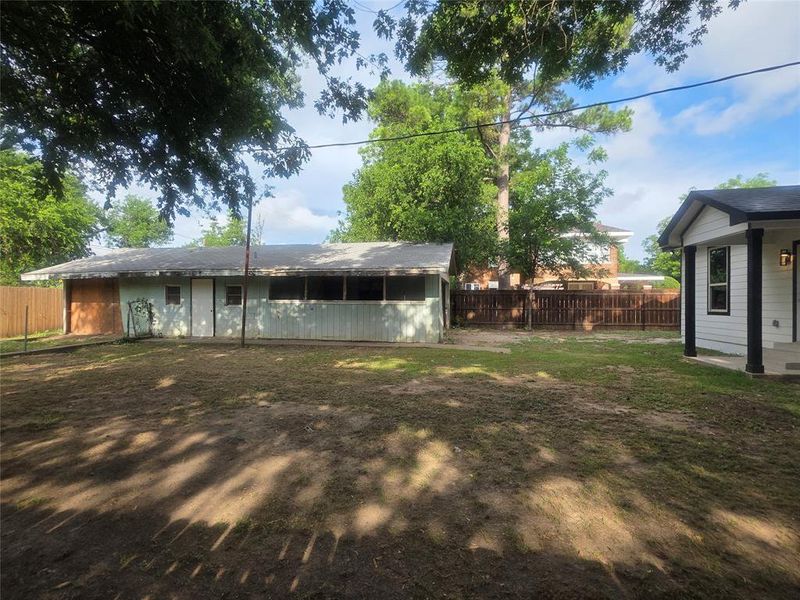 Detached Carport with storage room in back.