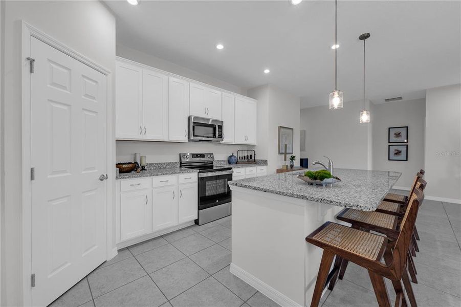 Furnished interior view inside a new home in Covered Bridge at Liberty Bluff, Haines City (Image 11). Furnished interior view inside a new home in Covered Bridge at Liberty Bluff, Haines City (Image 11).