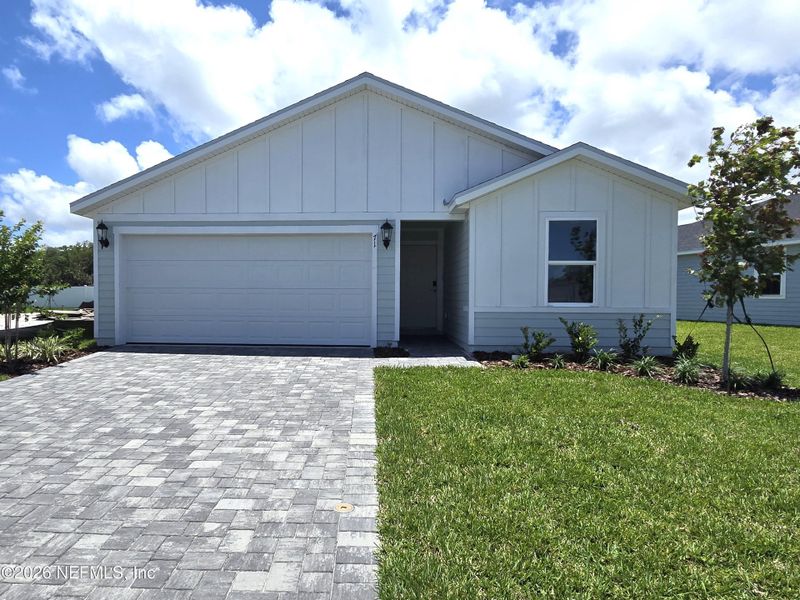 Front exterior of a new home in Colbert Landings, Palm Coast, FL, highlighting curb appeal (Image 18).