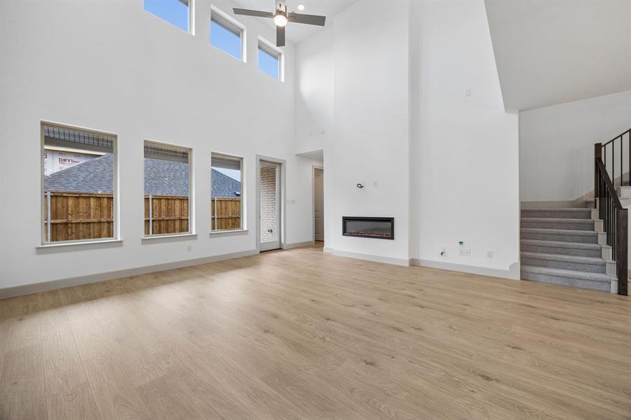Your new family room is flooded with natural light from a dual stacked wall of windows!