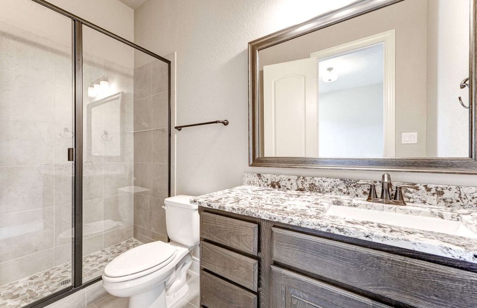 Representative furnished interior of a home built from the 4590 by Ravenna Homes in Artavia 70′, Conroe (Image 11).