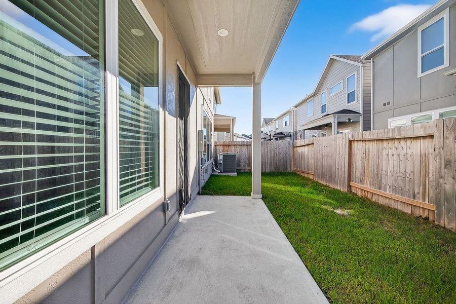 Exterior details and patio area of a home in Spring Brook Village - Luxe Series, Houston (Image 3).