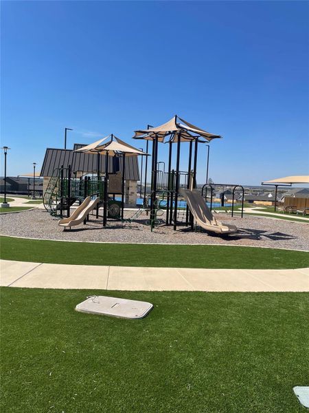 Community playground with a yard