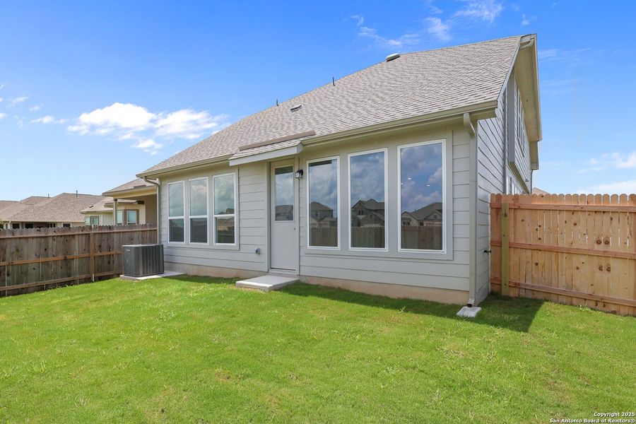 Front exterior of a new home in Rhine Valley, Schertz, TX, highlighting curb appeal (Image 2).