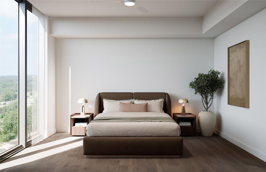 Bedroom showcasing soft natural light, wood flooring, and warm neutral finishes. Features a picture window with vista and treetop views, creating a serene, well-balanced retreat.