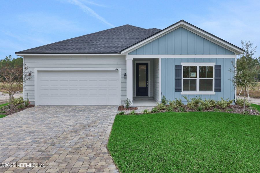 Front exterior of a new home in Brook Forest - Single Family Homes, St. Augustine, FL, highlighting curb appeal (Image 1). Front exterior of a new home in Brook Forest - Single Family Homes, St. Augustine, FL, highlighting curb appeal (Image 1).