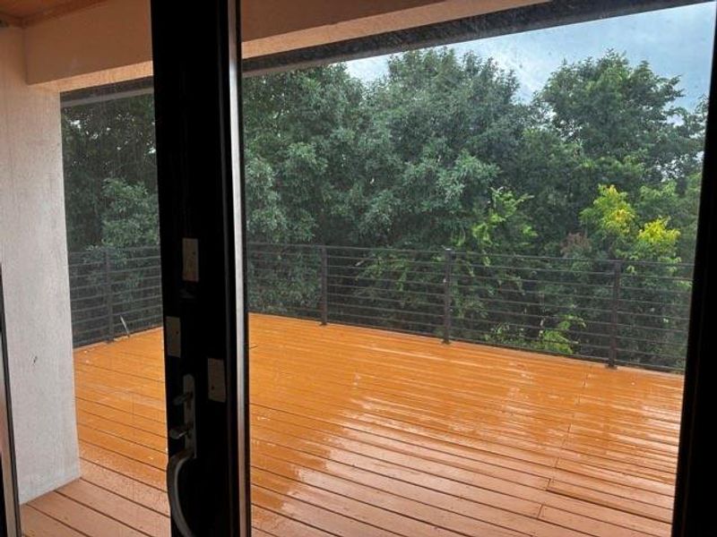 Doorway with hardwood / wood-style floors