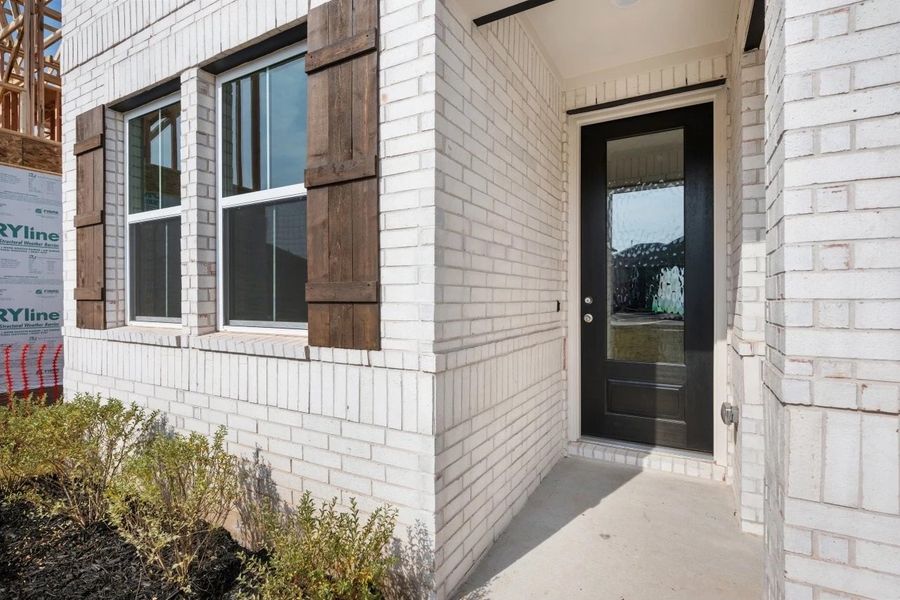 Exterior details and patio area of a home in The Colony, Bastrop (Image 3).