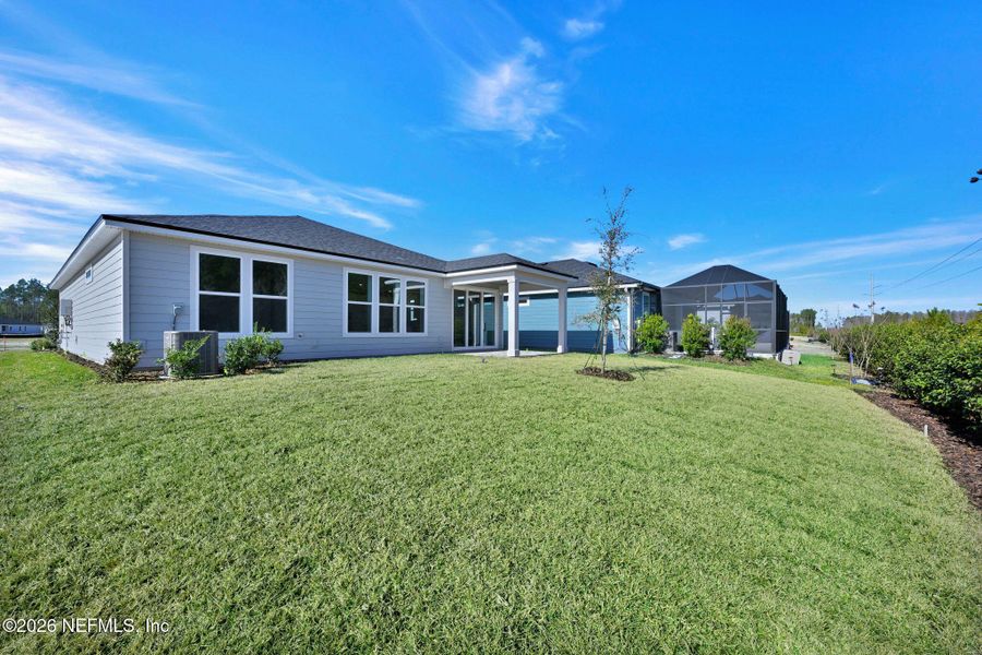 Exterior details and patio area of a home in Del Webb Wildlight, Yulee (Image 3).