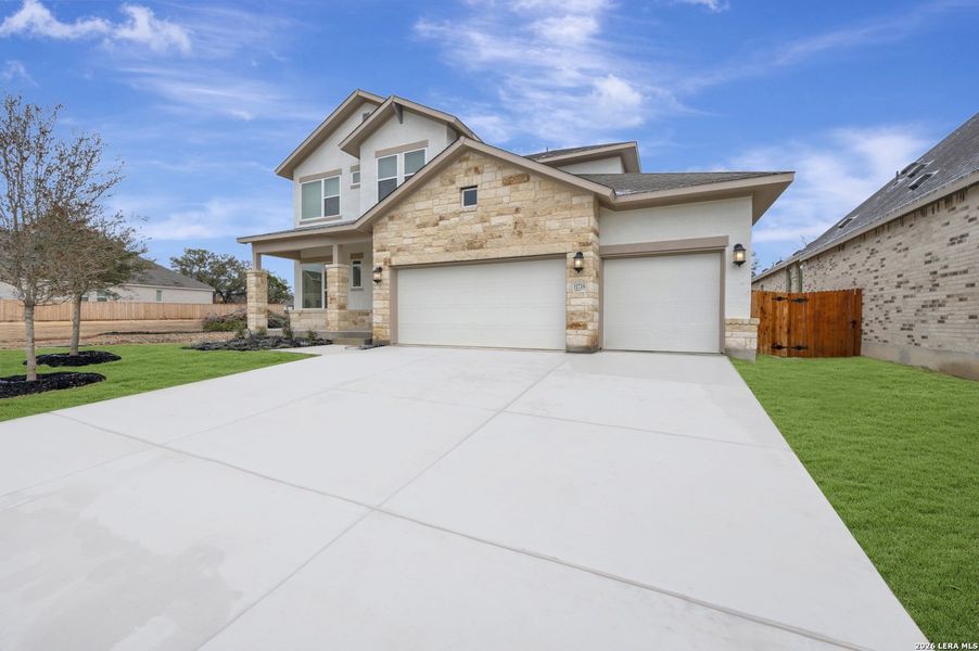 Front exterior of a new home in Davis Ranch 60', San Antonio, TX, highlighting curb appeal (Image 20). Front exterior of a new home in Davis Ranch 60', San Antonio, TX, highlighting curb appeal (Image 20).