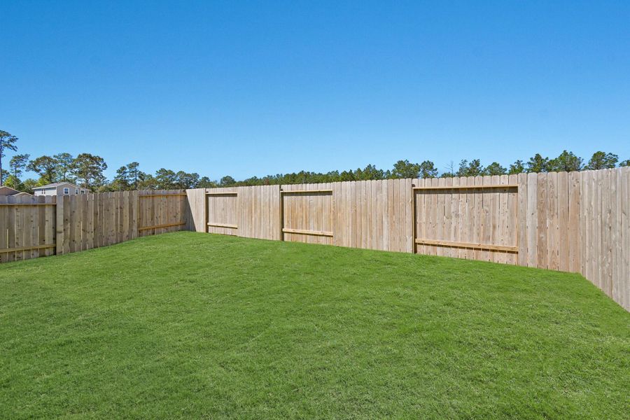 Exterior details and patio area of a home in , Conroe (Image 12).