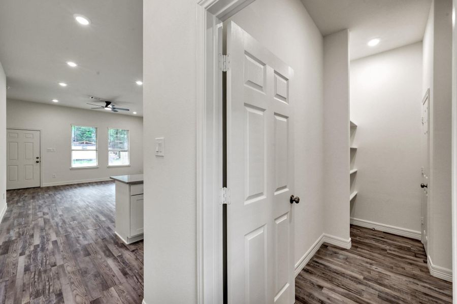 This home offers the ultimate convenience with a laundry room seamlessly tucked behind the kitchen, enhancing functionality and ease.