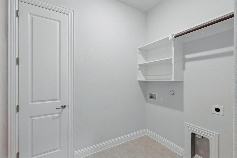 Laundry room with gas dryer hookup, hookup for a washing machine, and hookup for an electric dryer