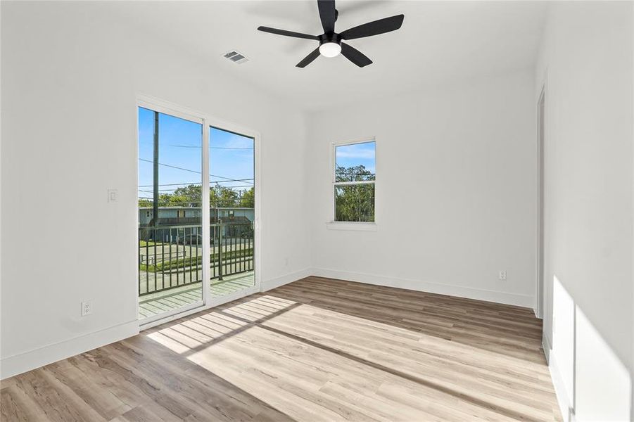 Unfurnished room with light wood-type flooring and a ceiling fan