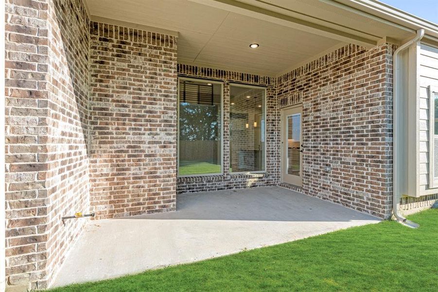 Exterior details and patio area of a home in Woodstone, Providence Village (Image 24). Exterior details and patio area of a home in Woodstone, Providence Village (Image 24).