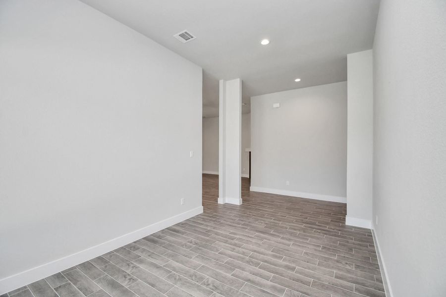 Craft enduring memories with loved ones around the table! This roomy dining area boasts stylish flooring, personalized paint, and is conveniently situated next to the family room and kitchen, fostering an open and inclusive ambiance. Sample photo of completed home with similar floor plan. Actual colors and selections may vary. Craft enduring memories with loved ones around the table! This roomy dining area boasts stylish flooring, personalized paint, and is conveniently situated next to the family room and kitchen, fostering an open and inclusive ambiance. Sample photo of completed home with similar floor plan. Actual colors and selections may vary.