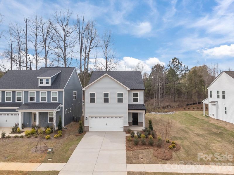 Front exterior of a new home in Farms at Bellingham, Mooresville, NC, highlighting curb appeal (Image 19).
