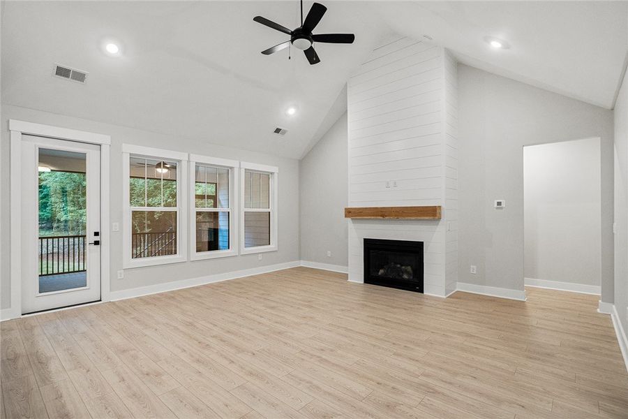 A striking fireplace with a rustic wooden mantel a A striking fireplace with a rustic wooden mantel a