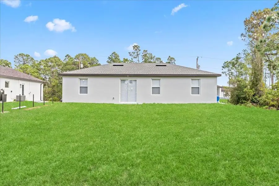 Exterior details and patio area of a home in , Lehigh Acres (Image 4).