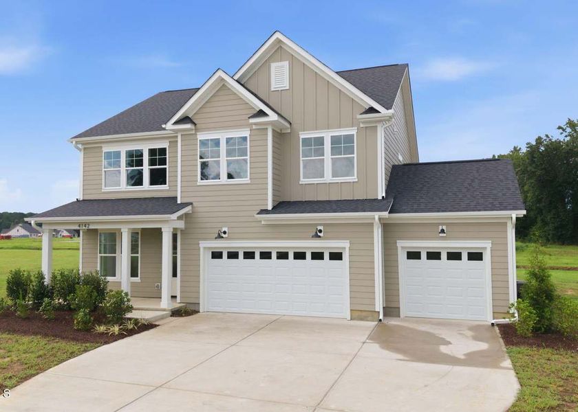 Front exterior of a new home in Dixon Grove, Grimesland, NC, highlighting curb appeal (Image 17).