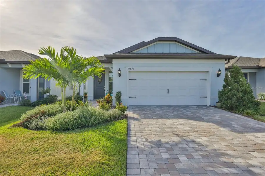 Front exterior of a new home in Del Webb BayView, Parrish, FL, highlighting curb appeal (Image 2).