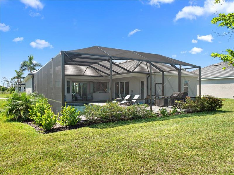 Front exterior of a new home in , Venice, FL, highlighting curb appeal (Image 22). Front exterior of a new home in , Venice, FL, highlighting curb appeal (Image 22).