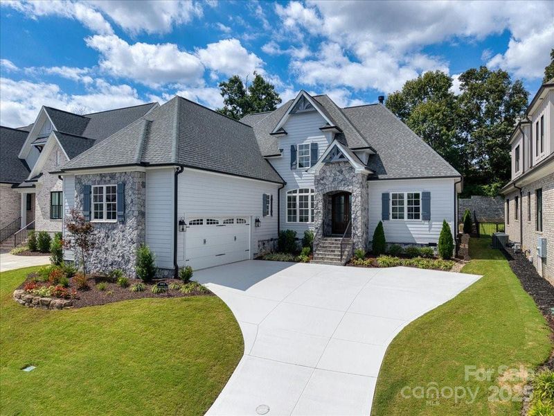 Front exterior of a new home in , Simpsonville, SC, highlighting curb appeal (Image 22).
