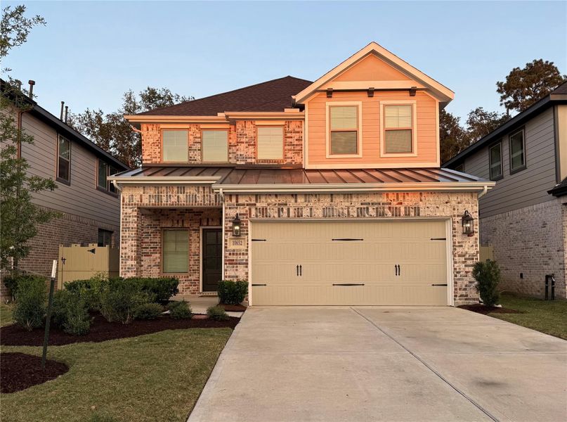 Front exterior of a new home in , Conroe, TX, highlighting curb appeal (Image 1).
