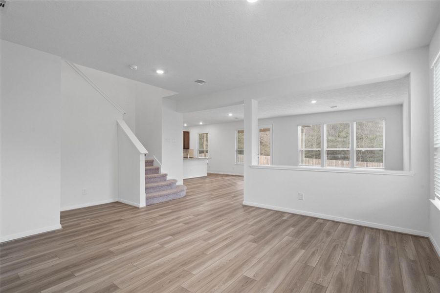 View from the Flex Room looking into the Great Room open concept living space - conveniently keeping connected to the remainder of the home.