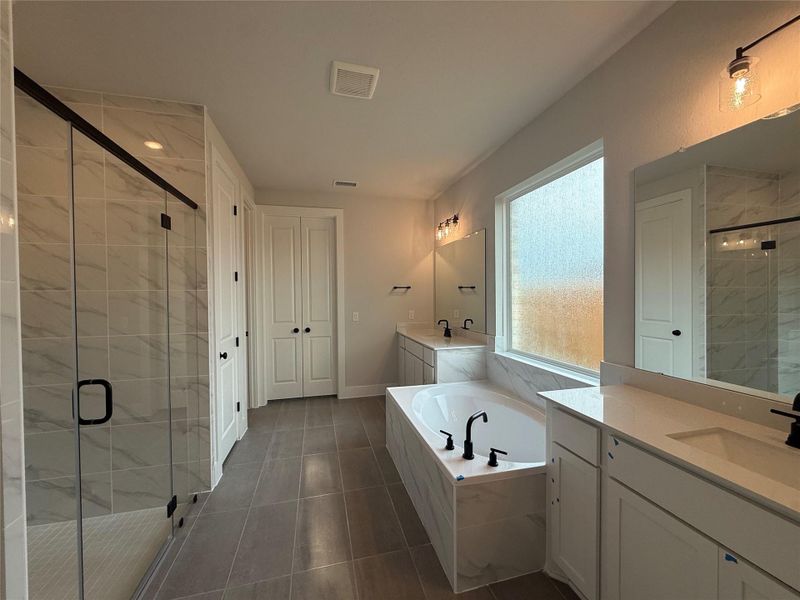 Primary Bath with dual vanities, garden tub & walk-in shower Primary Bath with dual vanities, garden tub & walk-in shower