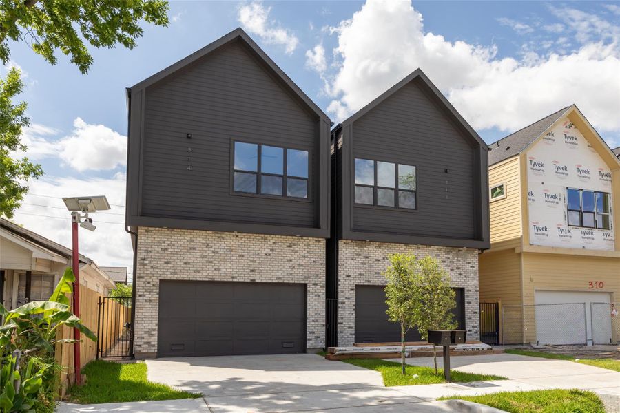 Front exterior of a new home in , Houston, TX, highlighting curb appeal (Image 24).
