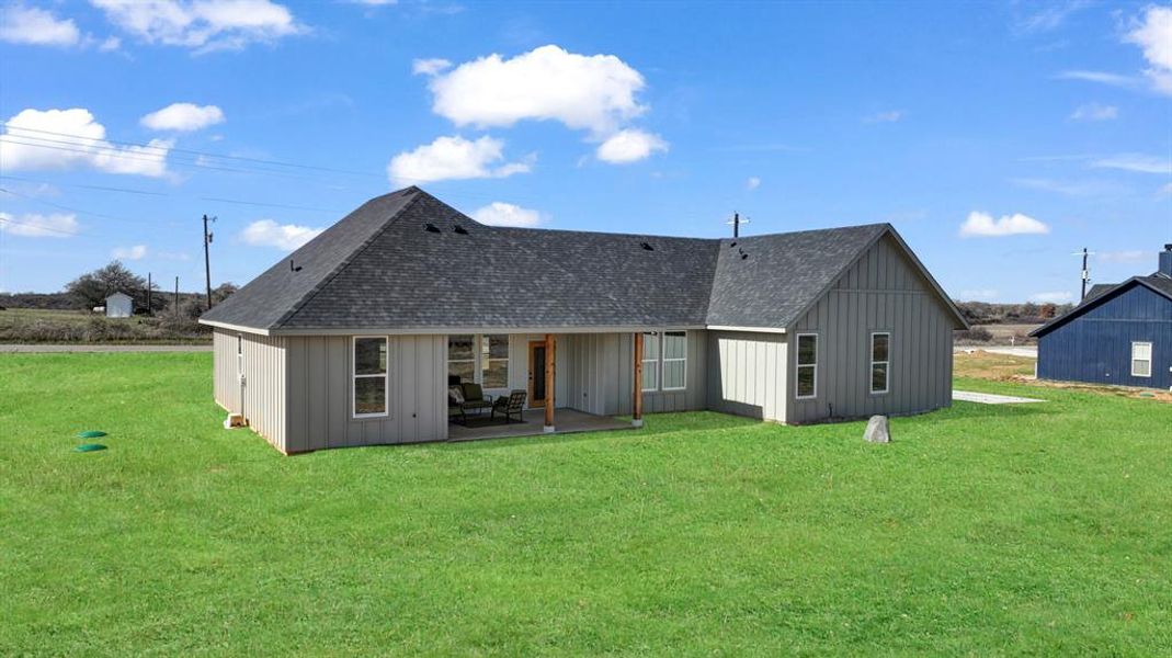 Exterior details and patio area of a home in Parallel Pastures, Poolville (Image 26).