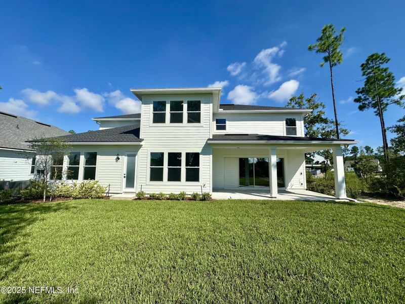 Front exterior of a new home in SilverLeaf, St. Augustine, FL, highlighting curb appeal (Image 20). Front exterior of a new home in SilverLeaf, St. Augustine, FL, highlighting curb appeal (Image 20).