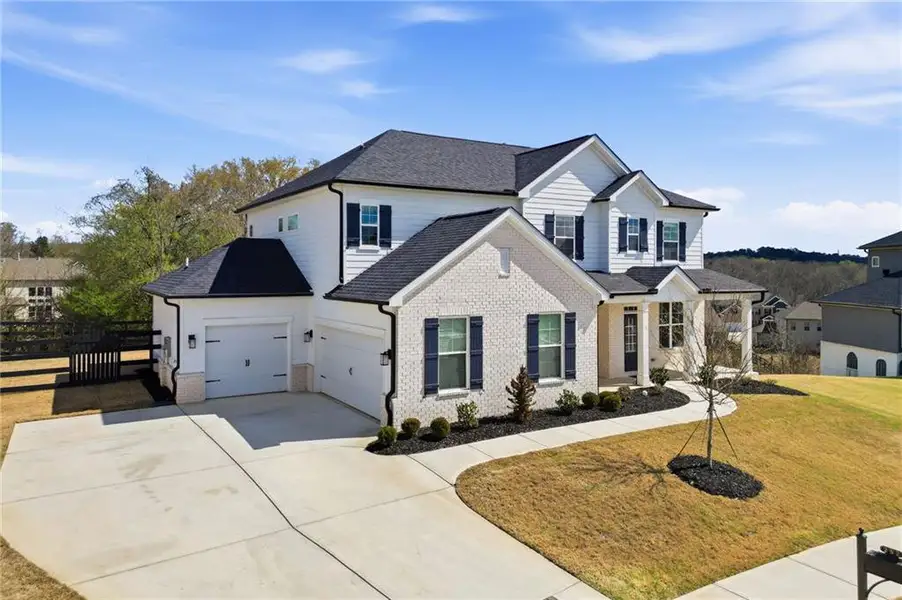 Front exterior of a new home in Carmichael Farms, Canton, GA, highlighting curb appeal (Image 23).