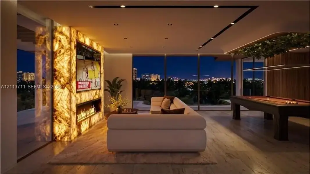 Illuminated natural stone wall feature with integrated linear fireplace, floor-to-ceiling glass wall panels, recessed ceiling lighting, and wood-finish flooring