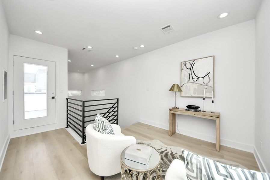 Fourth-floor flex space with direct access to the rooftop terrace.