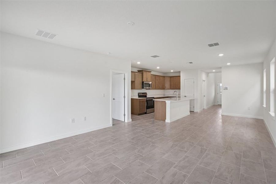 Spacious, unfurnished interior of a new home in Grasslands West, Lakeland (Image 32).
