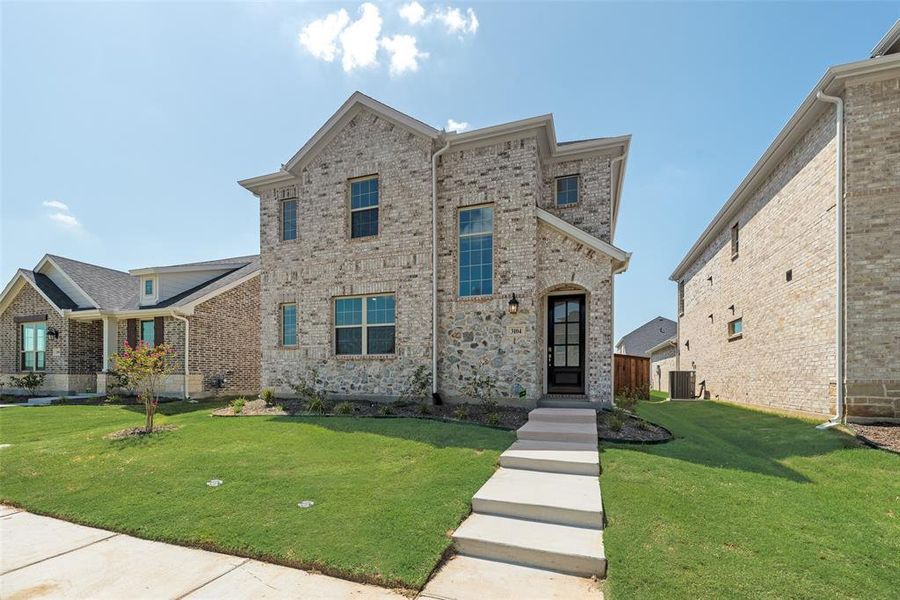 Front exterior of a new home in Arbors at Legacy Hills, Celina, TX, highlighting curb appeal (Image 17). Front exterior of a new home in Arbors at Legacy Hills, Celina, TX, highlighting curb appeal (Image 17).