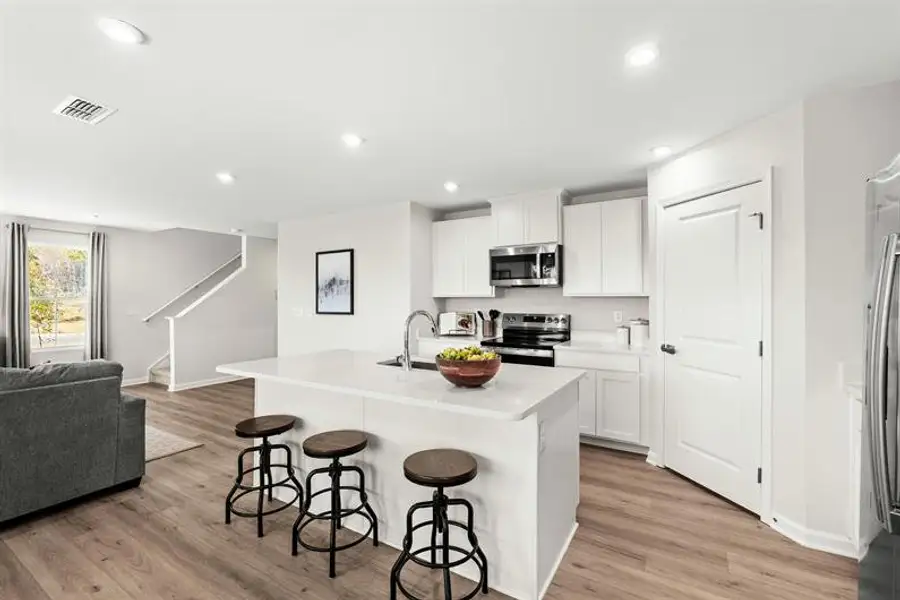 Representative furnished interior of a home built from the Woodford by Ryan Homes in Oakwood Trace, Fairburn (Image 3).