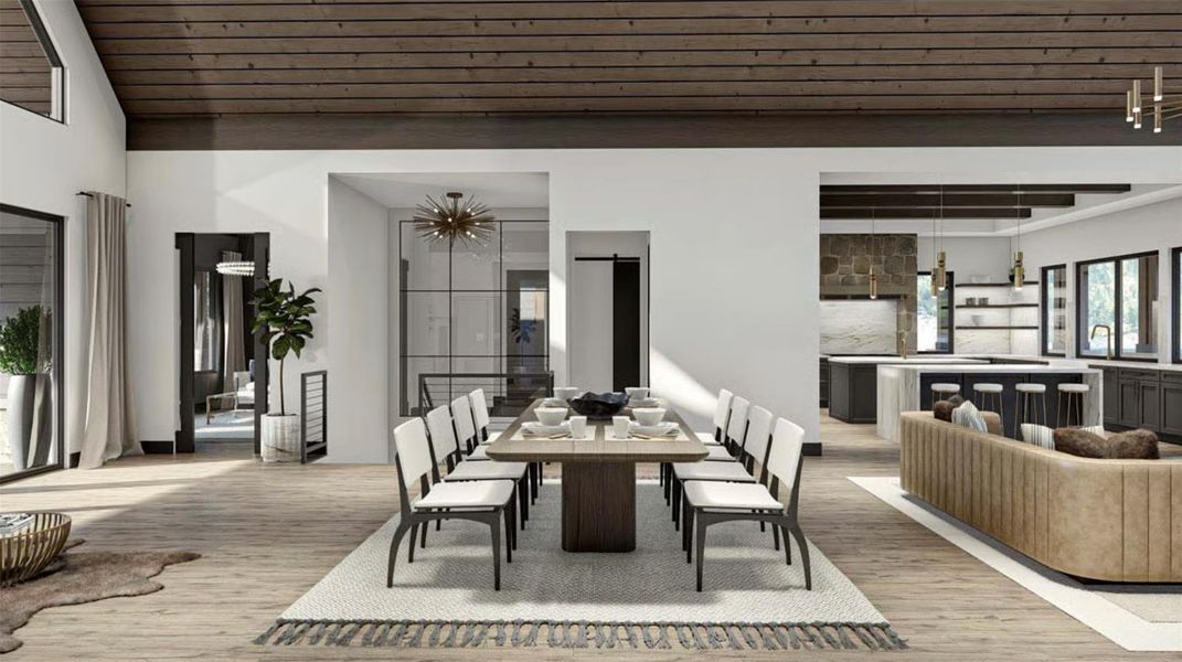 Dining room with wood finished floors and lofted ceiling Dining room with wood finished floors and lofted ceiling