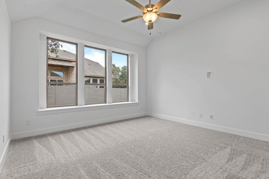 Primary Bedroom with elevated ceiling Primary Bedroom with elevated ceiling