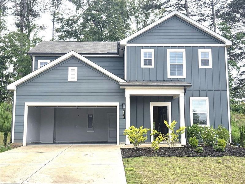 Front exterior of a new home in Alcovy Trace, Lawrenceville, GA, highlighting curb appeal (Image 21).